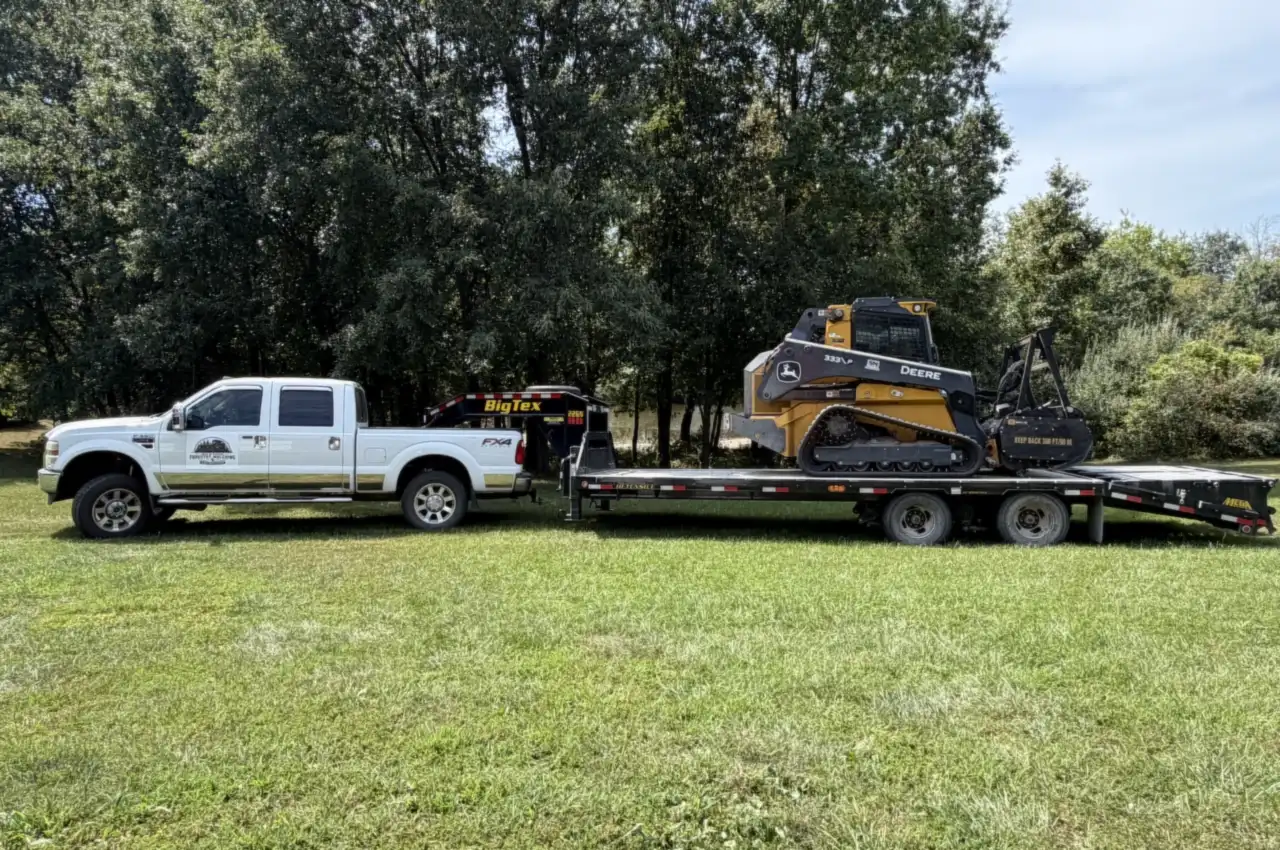 Mid Missouri Forestry Mulching truck and gooseneck trailer with the John Deere 333P forestry mulcher loaded